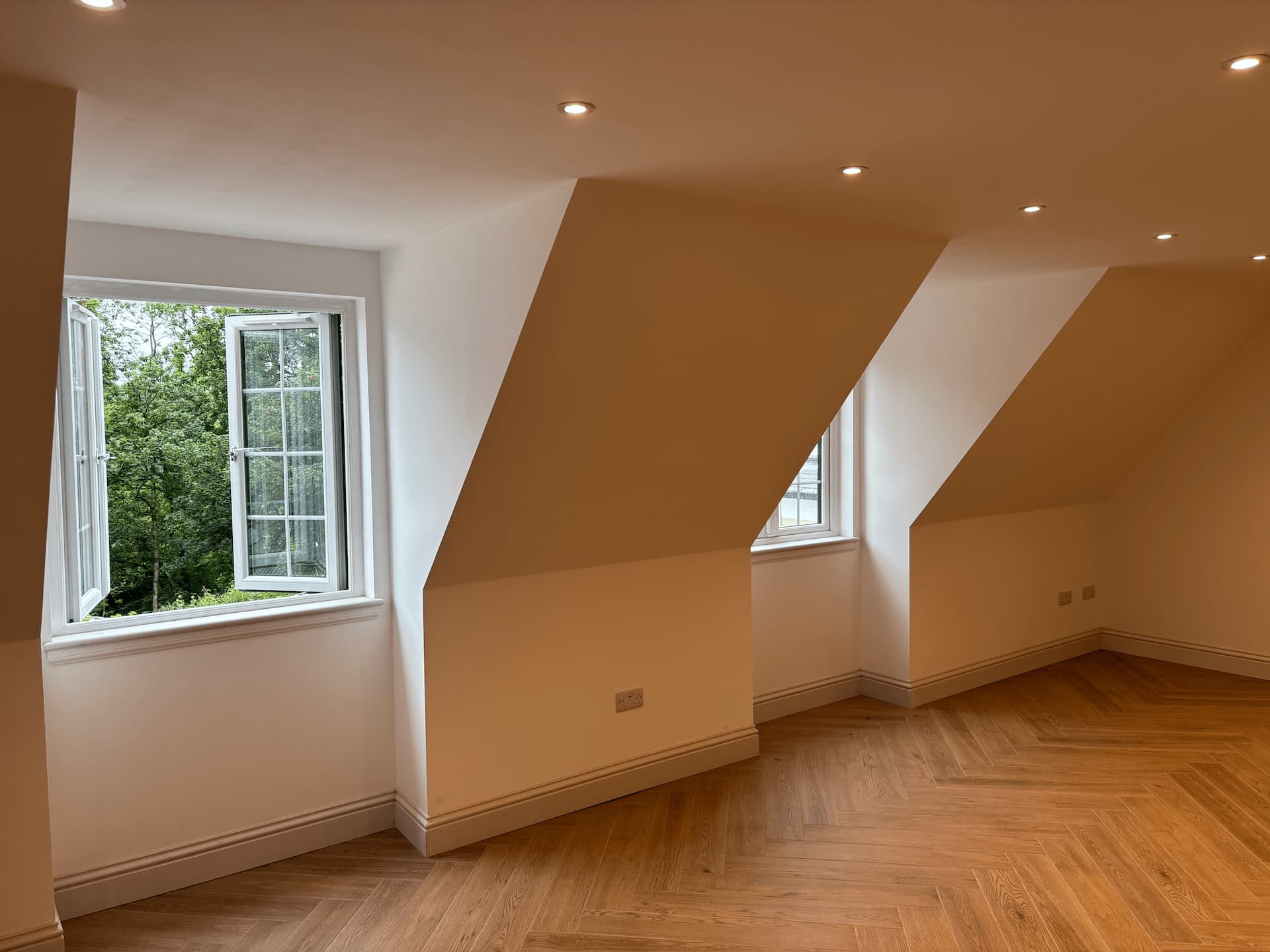 finished-garage-conversion-in-ayrshire-completed-by-jrj-joinery-with-herringbone-flooring-dormer-windows-and-recessed-led-lighting