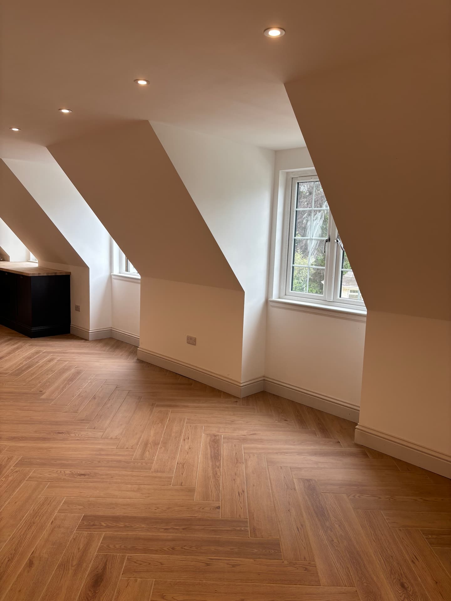 finished-garage-conversion-with-timber-cladding-and-dormer-windows